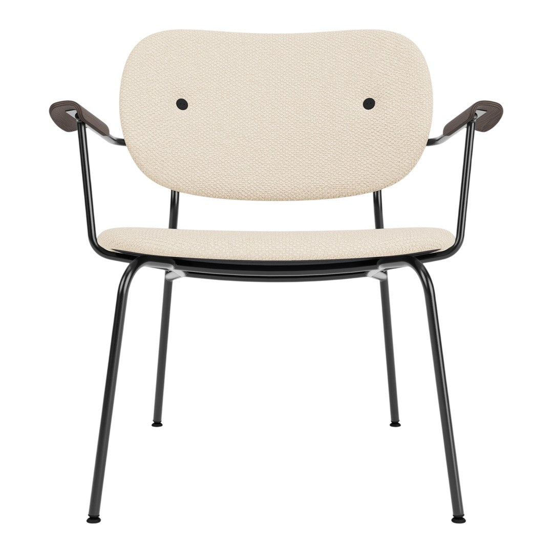 Beige fabric chair with black metal legs and arms, featuring a minimalist design and smooth, modern lines.