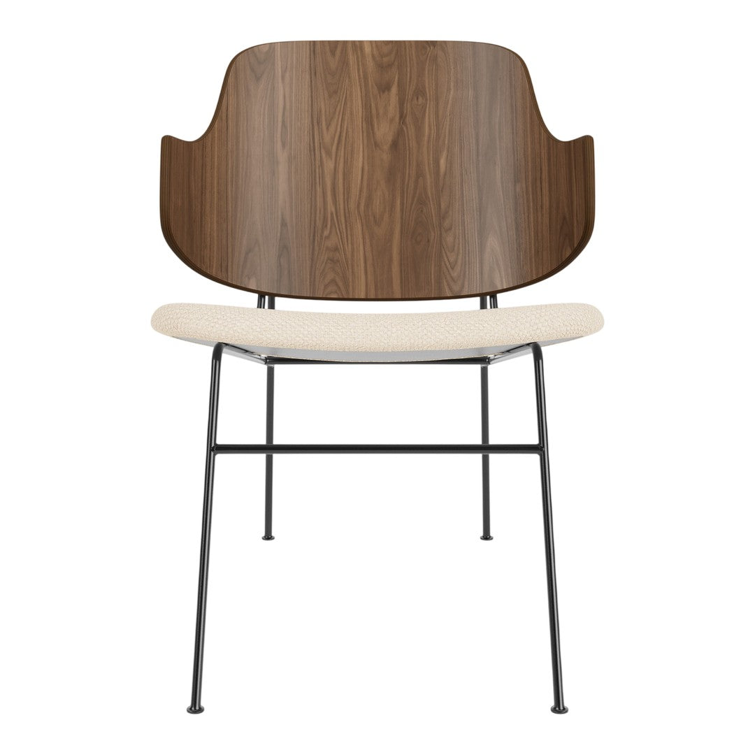 Modern chair featuring a walnut wood back, cream seat, and black metal legs, blending elegance with contemporary design.