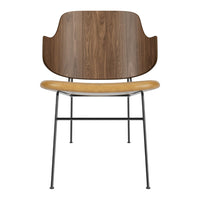 Wooden chair with a walnut backrest, tan seat, and black metal legs, showcasing a sleek, modern design.