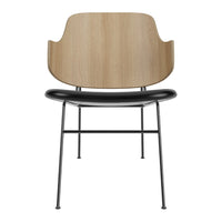 Wooden backrest, sleek black seat, and minimalistic metal legs create a modern, stylish chair design.