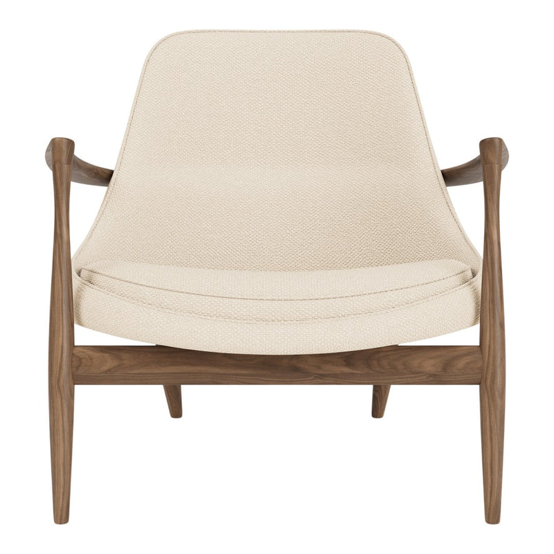 Cream-colored armchair with a smooth textured seat and rich walnut wooden frame. Modern and minimalist design.