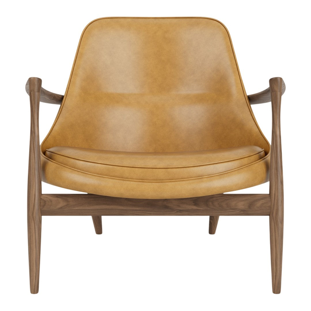 Tan leather armchair with a smooth finish and natural wood base, featuring a minimalist, modern design.