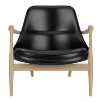 Modern black armchair with a sleek, smooth finish and light wooden frame, combining contemporary design with natural tones.