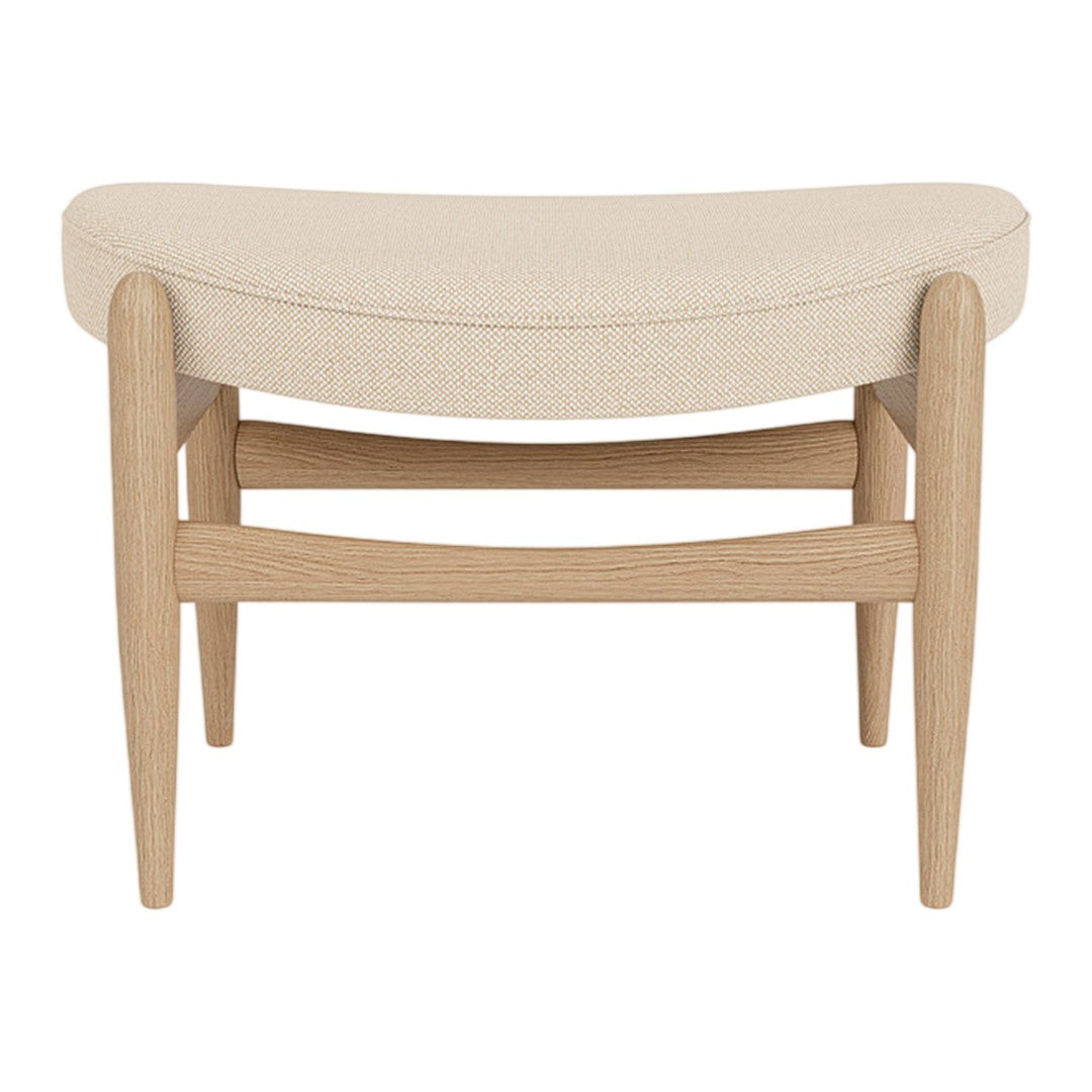 Beige upholstered stool with a curved design and light wood frame, featuring a minimalist style and clean lines.