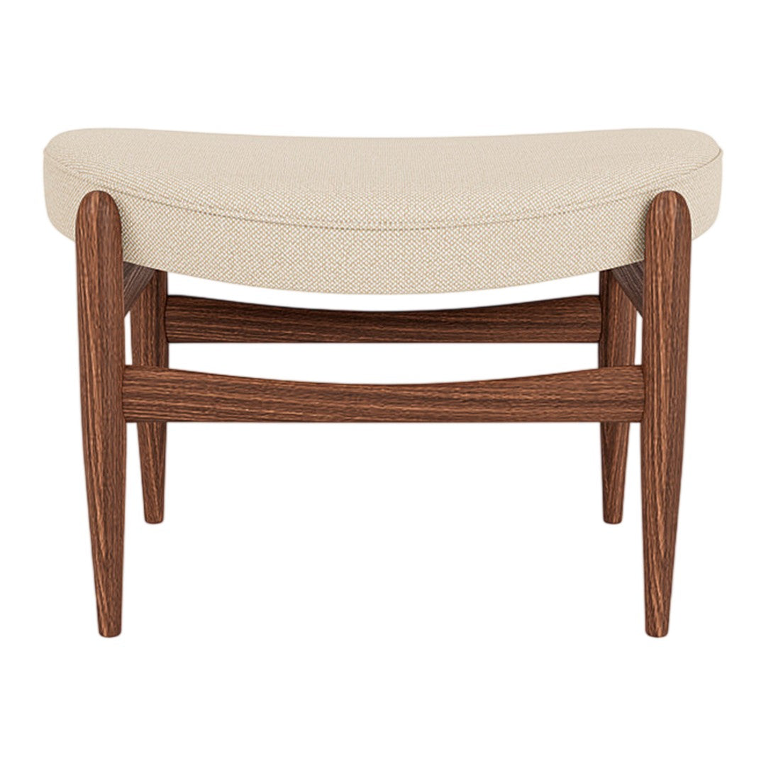 Cream upholstered bench with a curved top, featuring rich brown wooden legs and a smooth finish.
