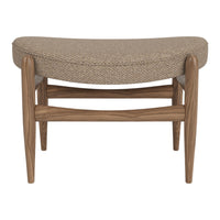 Textured beige upholstery with a natural wood frame, featuring a modern, curved design. Perfect for any decor.