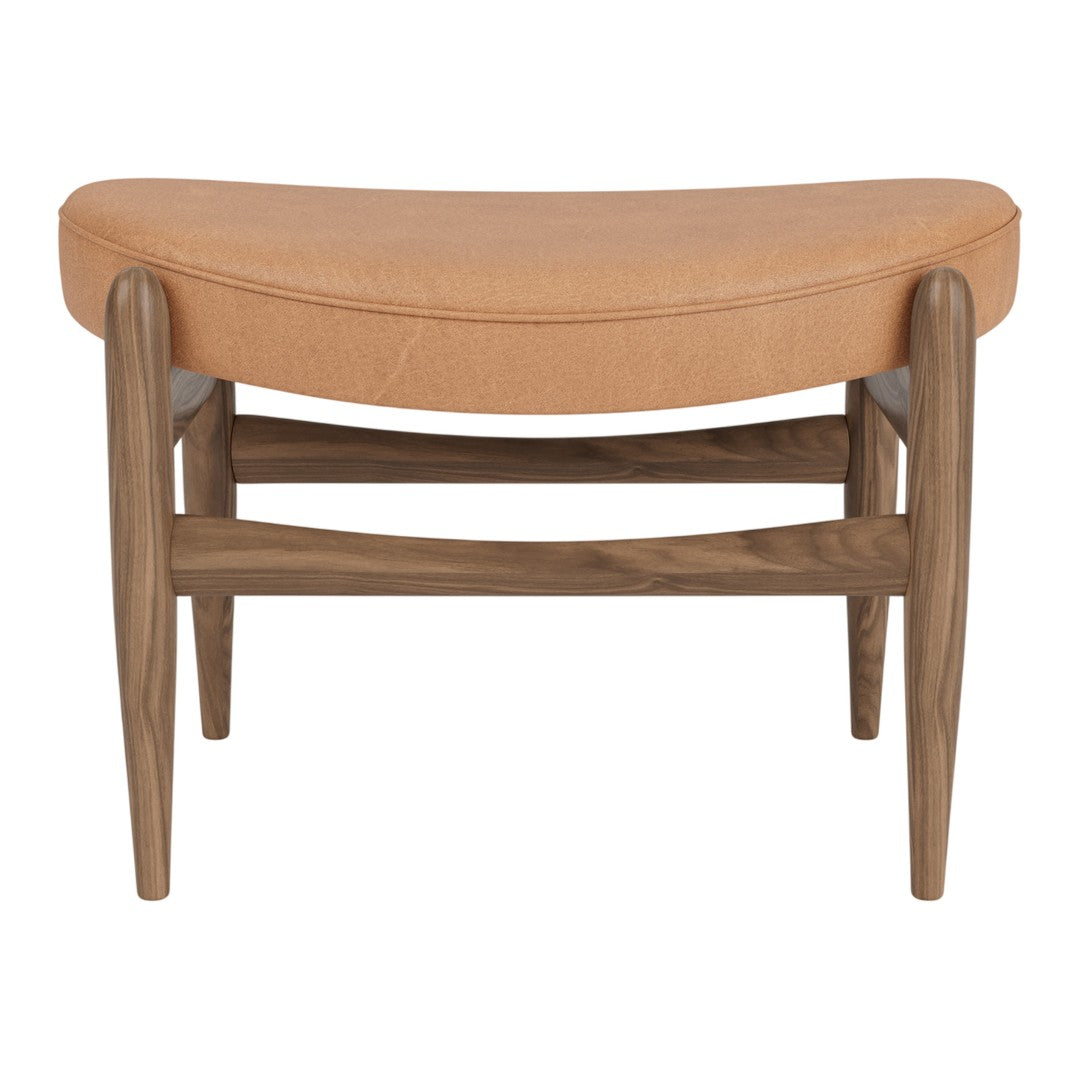 Tan leather upholstered stool with a curved design and wooden legs in a natural finish. Elegant and modern.