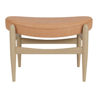 Curved orange leather seat with light wood legs, blending modern simplicity and warm color tones.