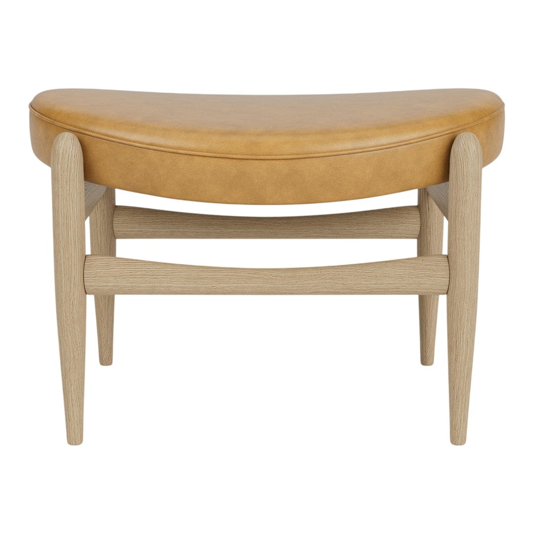 Brown leather cushion atop light wood legs, featuring a curved, minimalist design. Ideal for modern decor.