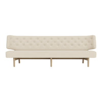 Beige tufted sofa with a minimalist design and wooden legs, perfect for modern decor.