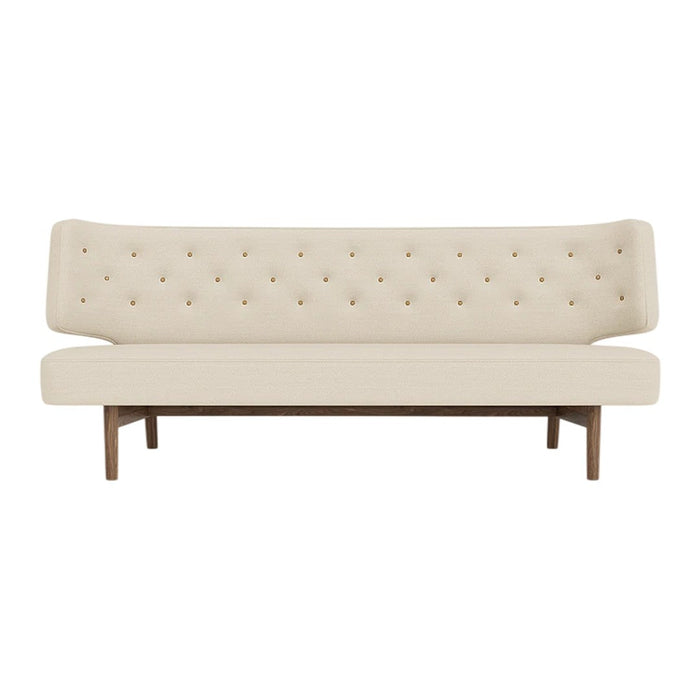 Cream-colored tufted sofa with a sleek wood base and elegant, minimalist design. Perfect for modern decor.