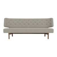 Light gray tufted sofa with a minimalist design and wooden legs, perfect for modern home decor.