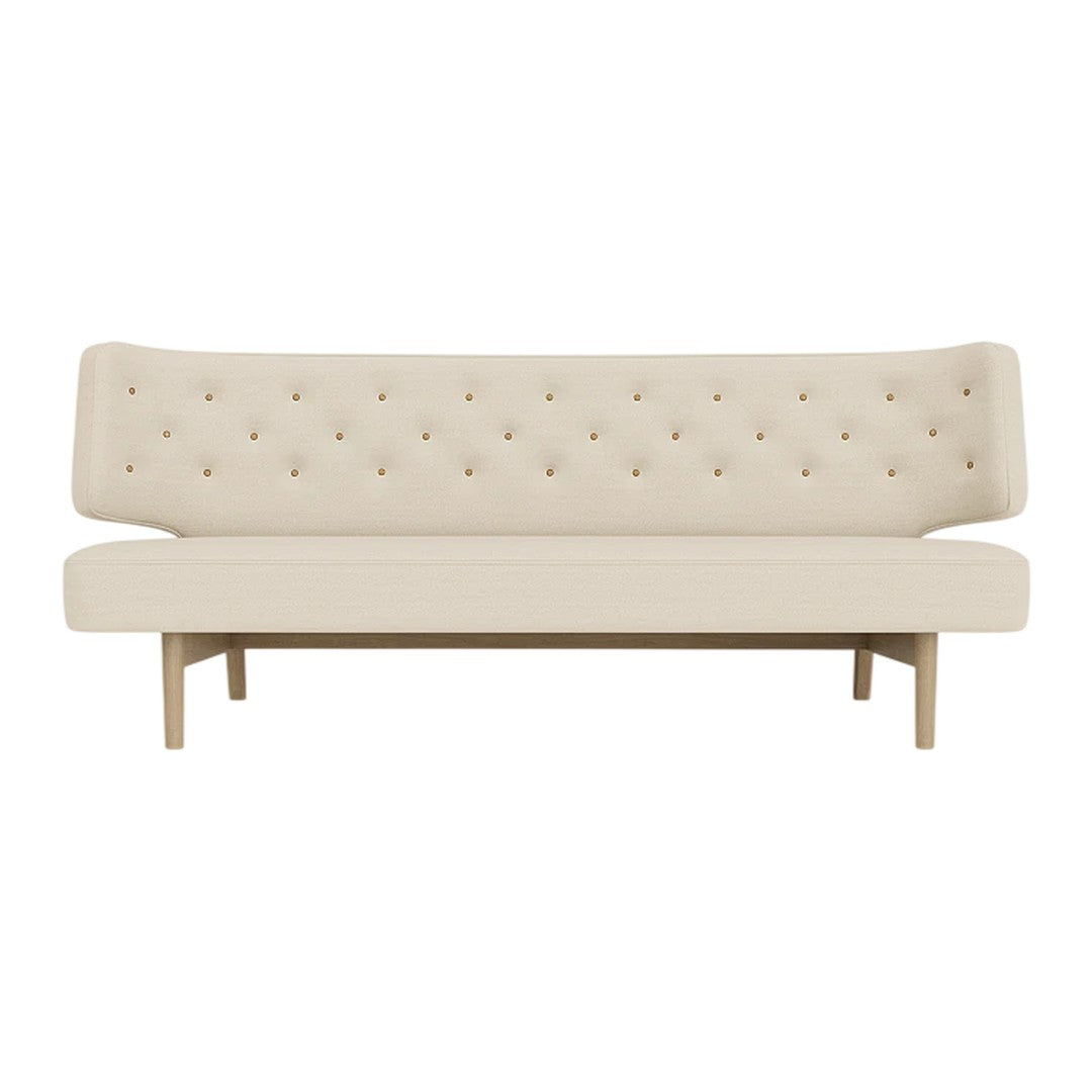 Beige tufted sofa with a sleek design and wooden legs, ideal for modern and minimalist decor.