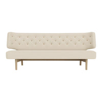 Beige tufted sofa with a sleek design and wooden legs, ideal for modern and minimalist decor.