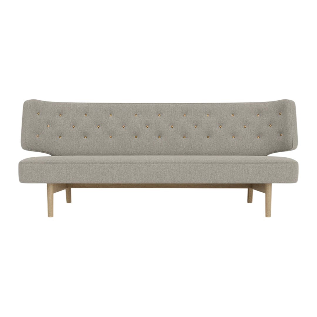 Light grey tufted sofa with a minimalist design and natural wood legs. Perfect for modern interiors.