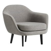Soft gray upholstered chair with a minimalist design and smooth, rounded contours, supported by sleek black legs.