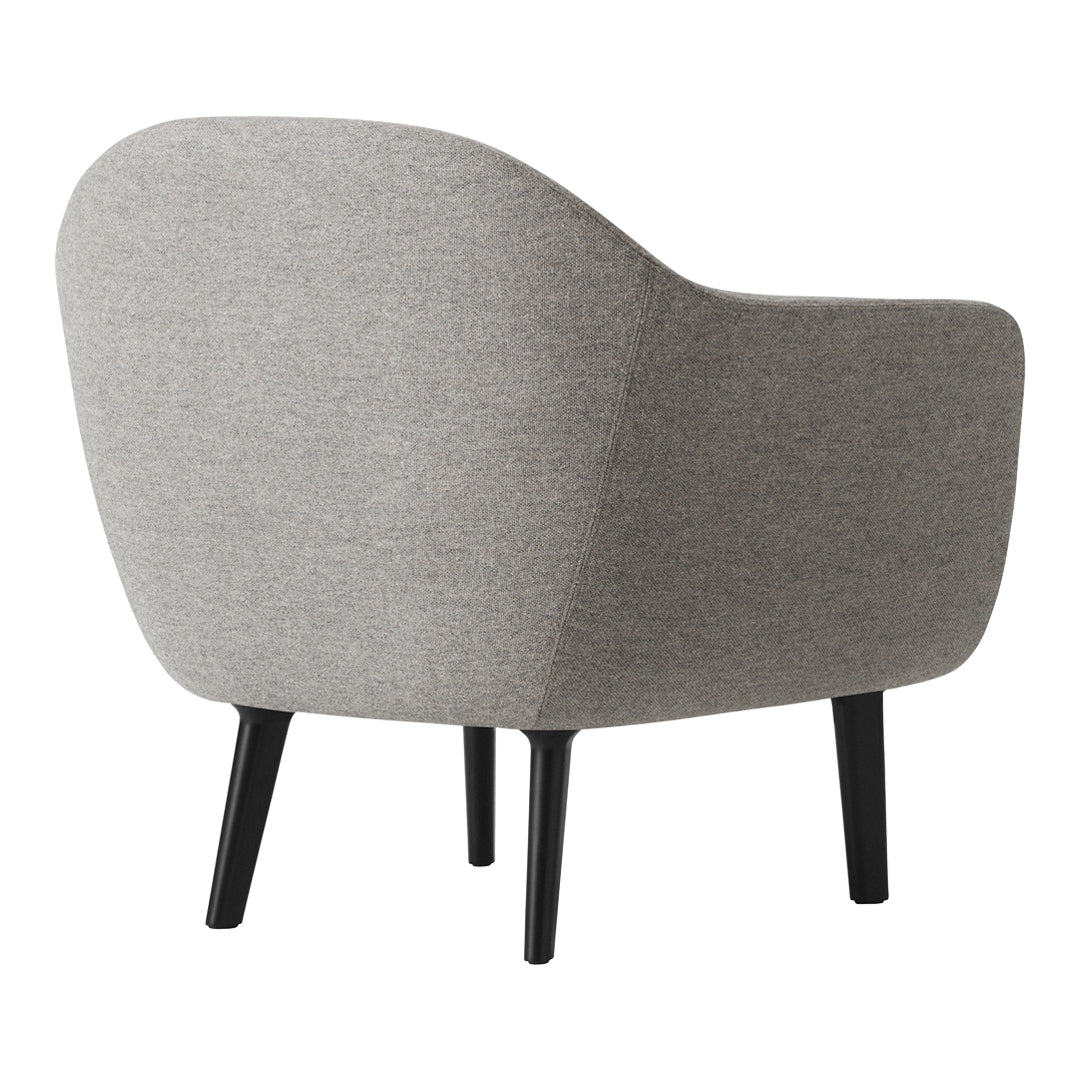 Cozy gray upholstered chair with smooth curves and black wooden legs, perfect for modern interiors.