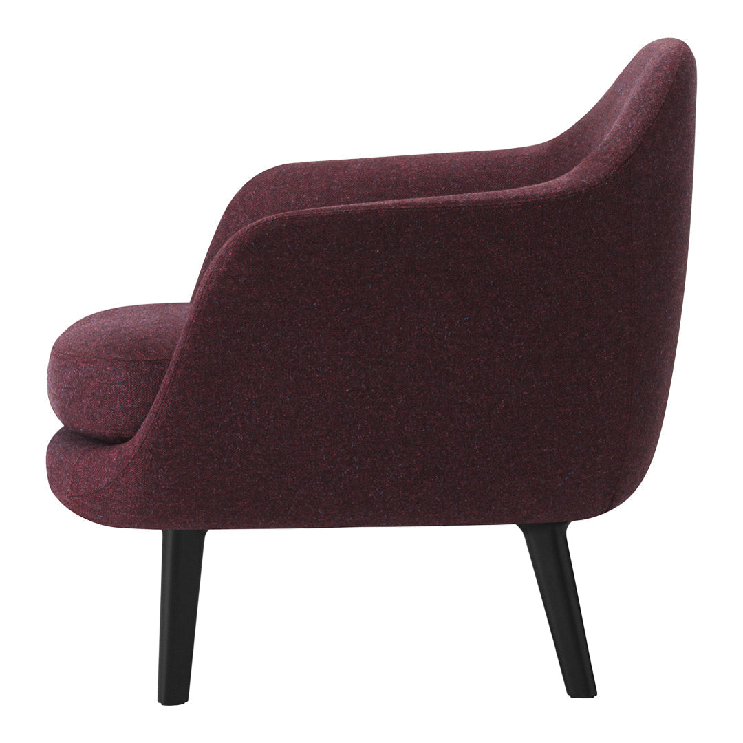 Curved burgundy chair with a textured fabric and sleek black legs, showcasing modern elegance and cozy design.
