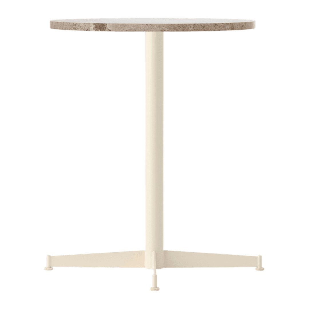 Round table with a beige and gray marble top and a cream-colored metal base, showcasing a modern minimalist design.
