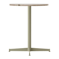 Round table with a speckled beige top and a matte olive green base, showcasing a modern minimalist design.