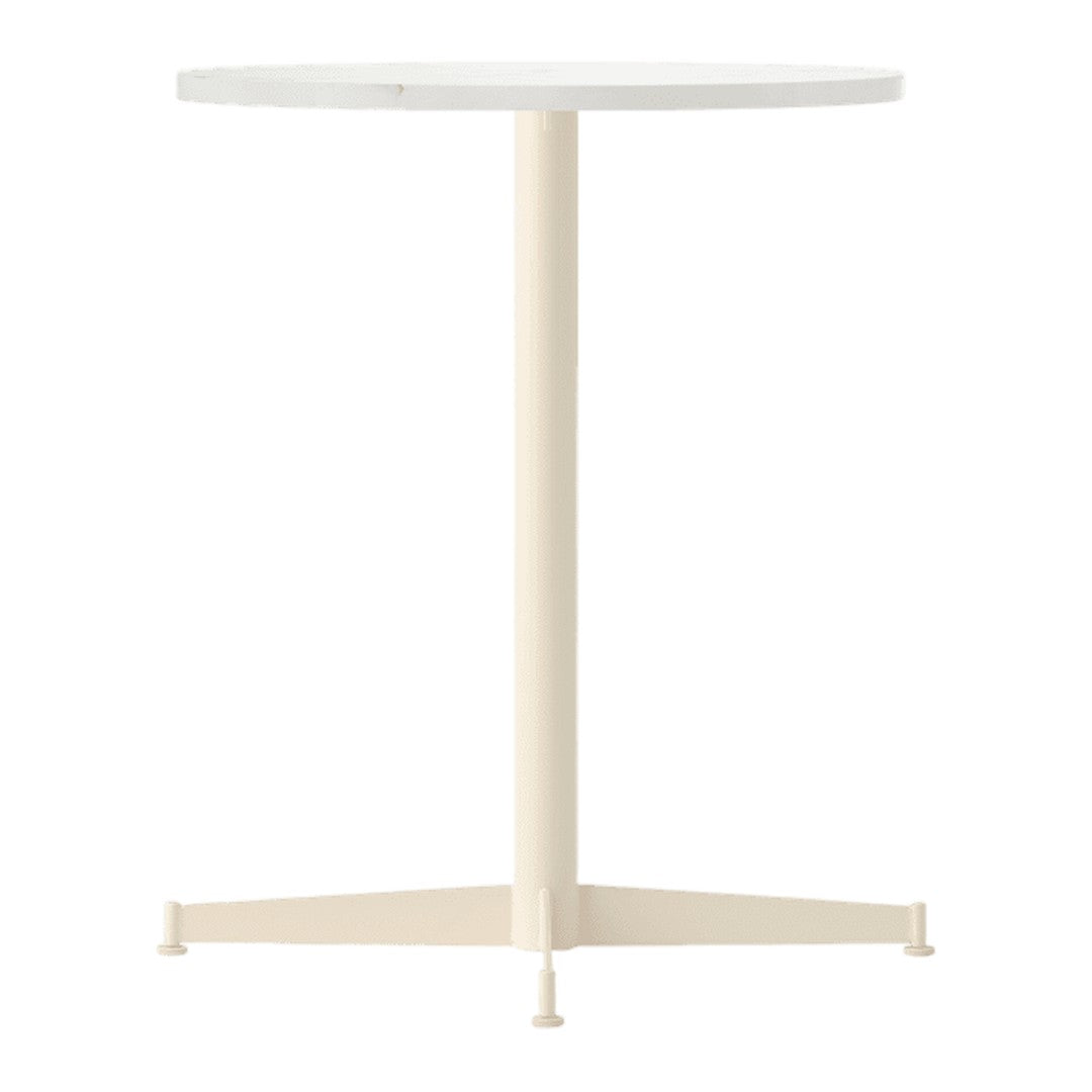 Round white table with a smooth surface and a light cream-colored base, featuring a minimalist design.