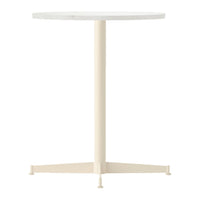 Round white table with a smooth surface and a light cream-colored base, featuring a minimalist design.
