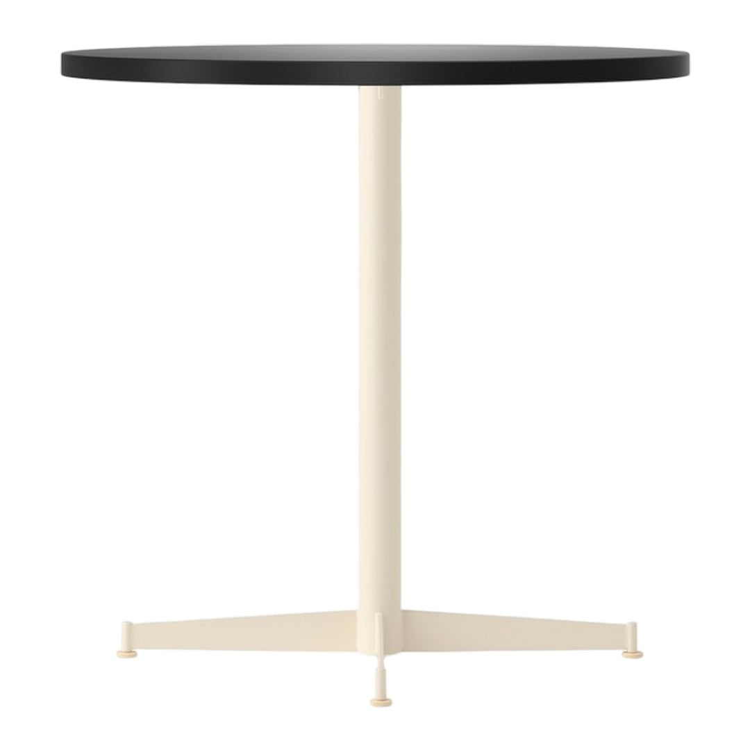 Black round tabletop with a cream-colored pedestal base, featuring a minimalist design. Ideal for modern decor.