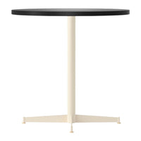 Black round tabletop with a cream-colored pedestal base, featuring a minimalist design. Ideal for modern decor.
