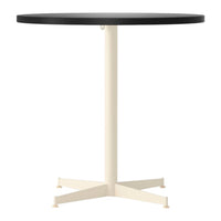 Round table with a sleek black top and a contrasting cream-colored base. Modern design for any space.