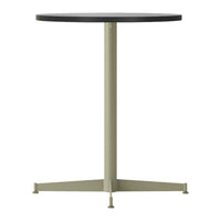 Round table features a black top and light olive green base, showcasing a sleek, modern design.