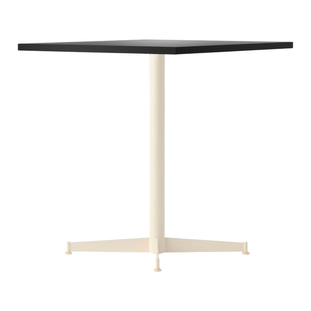 Square table with a sleek black top and a creamy beige base, featuring a minimalist design and clean lines.