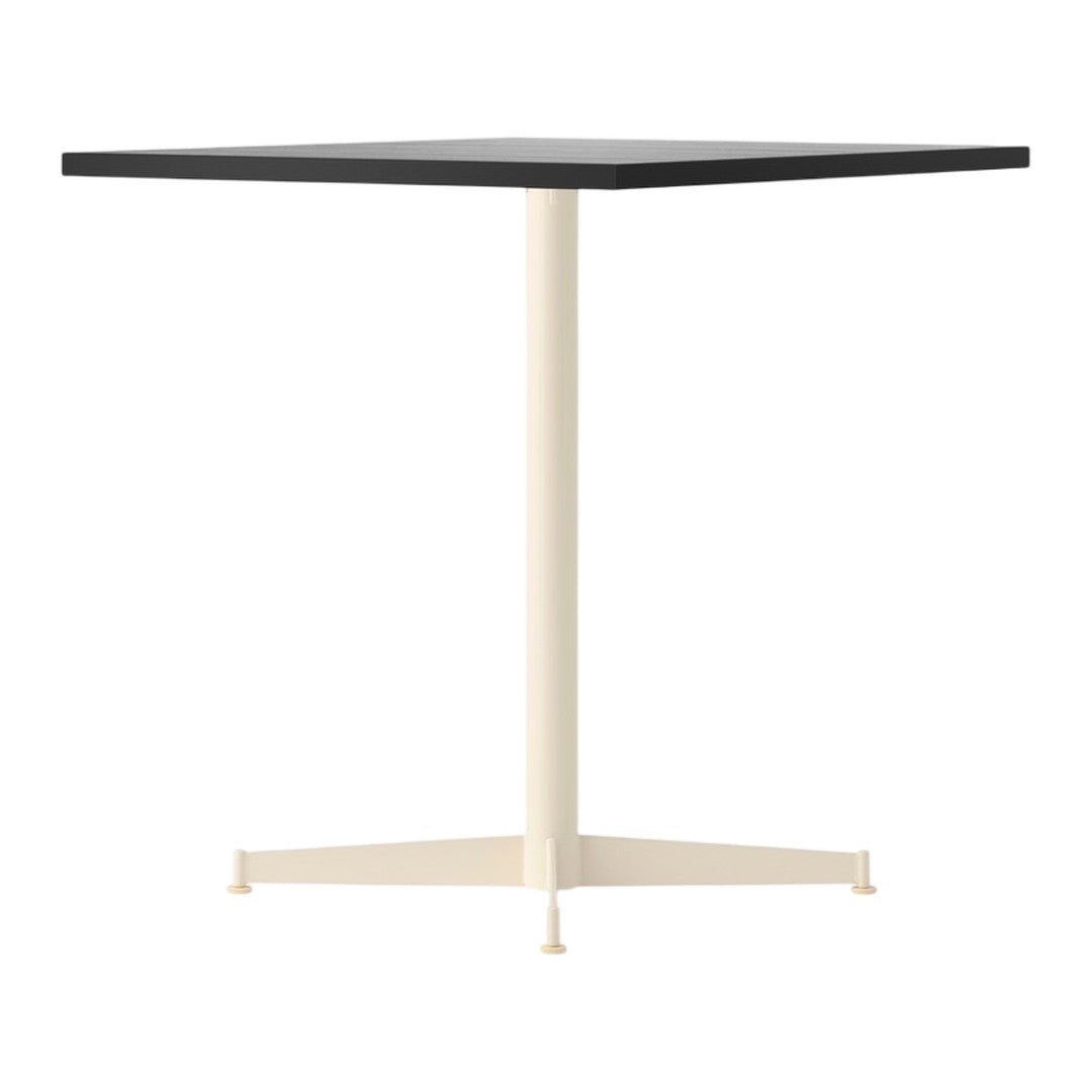 Square tabletop in black with a cream-colored pedestal, featuring a minimalist design and solid colors.