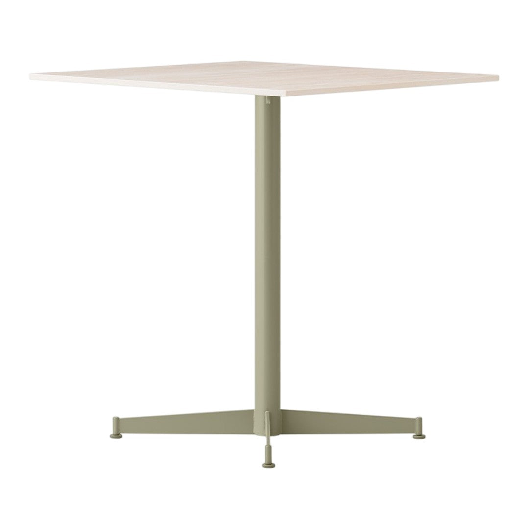 "Square tabletop in soft beige with a matte green metal base, perfect for modern decor."