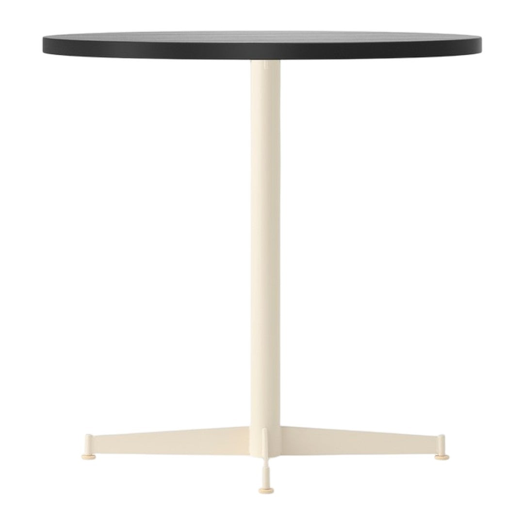 Round table with a black top and cream-colored base, featuring a simple, modern design. Perfect for contemporary spaces.