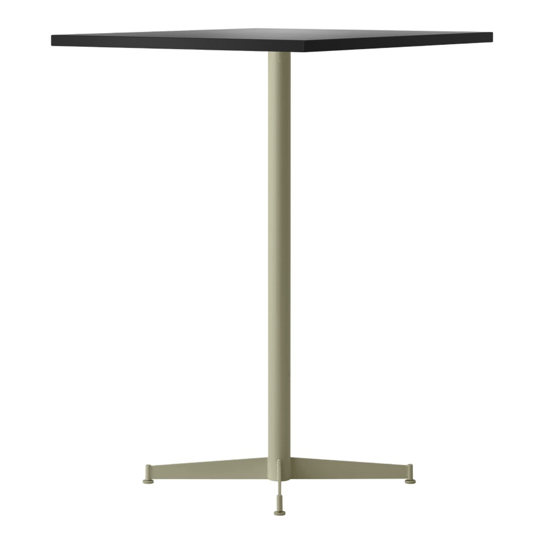 Square table with a black top and light green metal base, featuring a minimalist design and sleek lines.