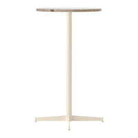 Round marble tabletop in earthy tones with a sleek cream metal base, perfect for modern decor.