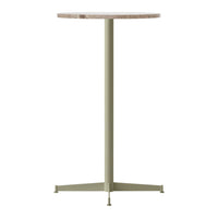 Round tabletop in natural wood finish with a light green metal base, minimalist design, ideal for modern decor.