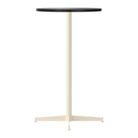 Minimalist round table featuring a black top and cream-colored, sturdy base. Perfect for modern decor.
