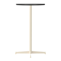 Black round tabletop with a cream-colored metal base, minimalist design, perfect for modern decor.