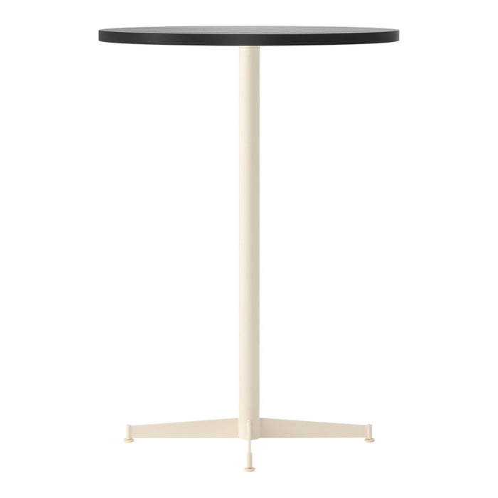 Round table with a sleek black top and a light cream-colored base. Perfect for modern decor.