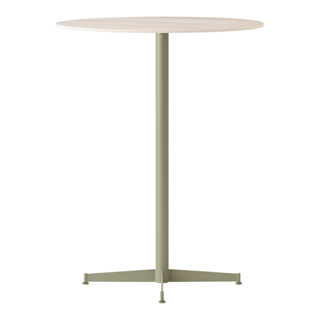 Round tabletop in light wood finish with a muted green metal base, featuring a minimalist design.