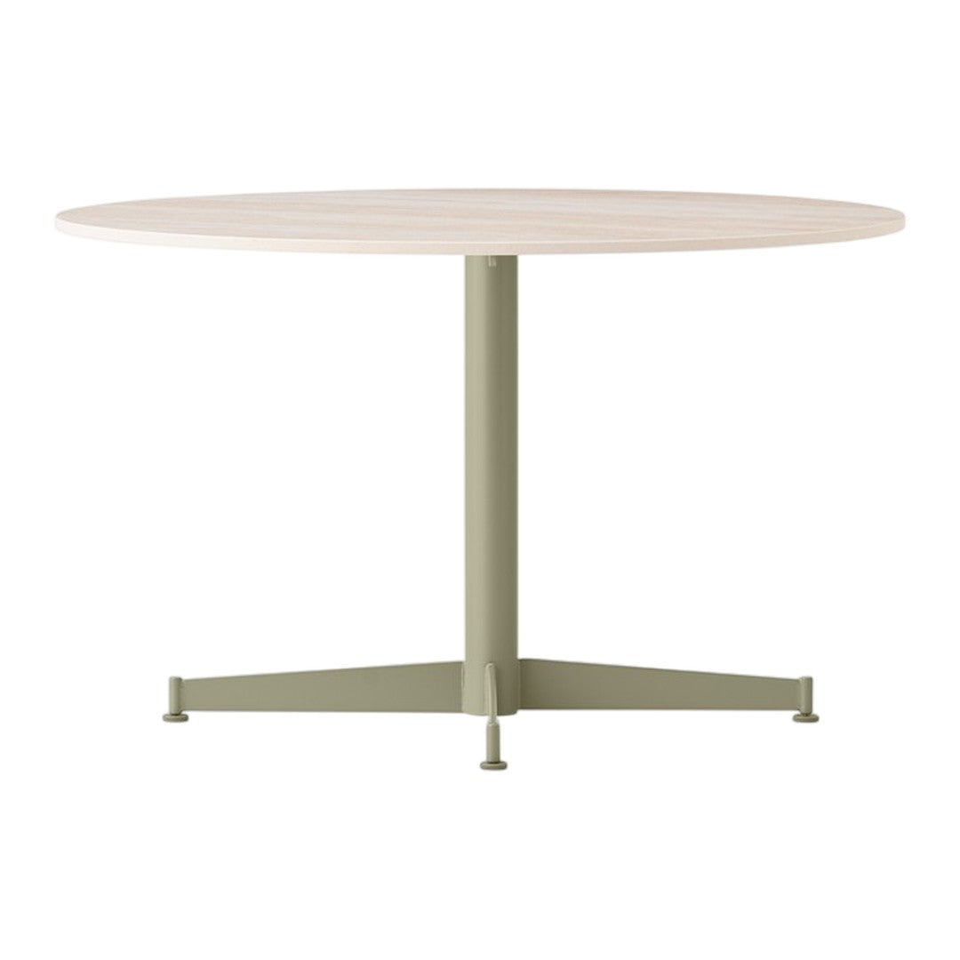 Round wooden table with a light beige top and a muted green metal base. Simple, modern design with minimal patterns.