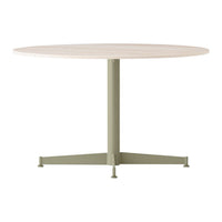 Round wooden table with a light beige top and a muted green metal base. Simple, modern design with minimal patterns.