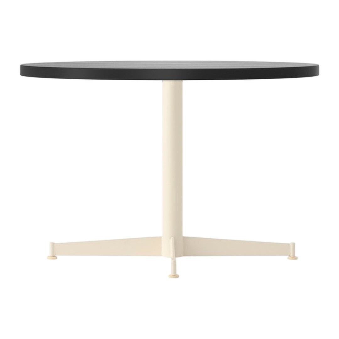 Round table featuring a sleek black top and a contrasting cream-colored base. Minimalist and modern design.