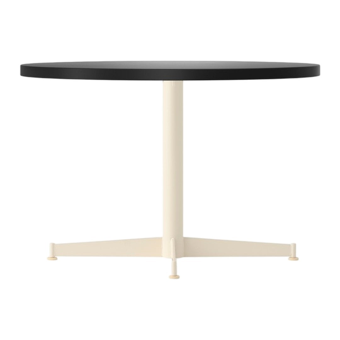Round table with a sleek black tabletop and a cream-colored pedestal base, featuring a minimalist design.