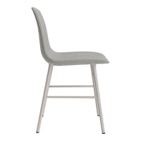 Gray upholstered dining chair with sleek metal legs, featuring a minimalist design and smooth lines.