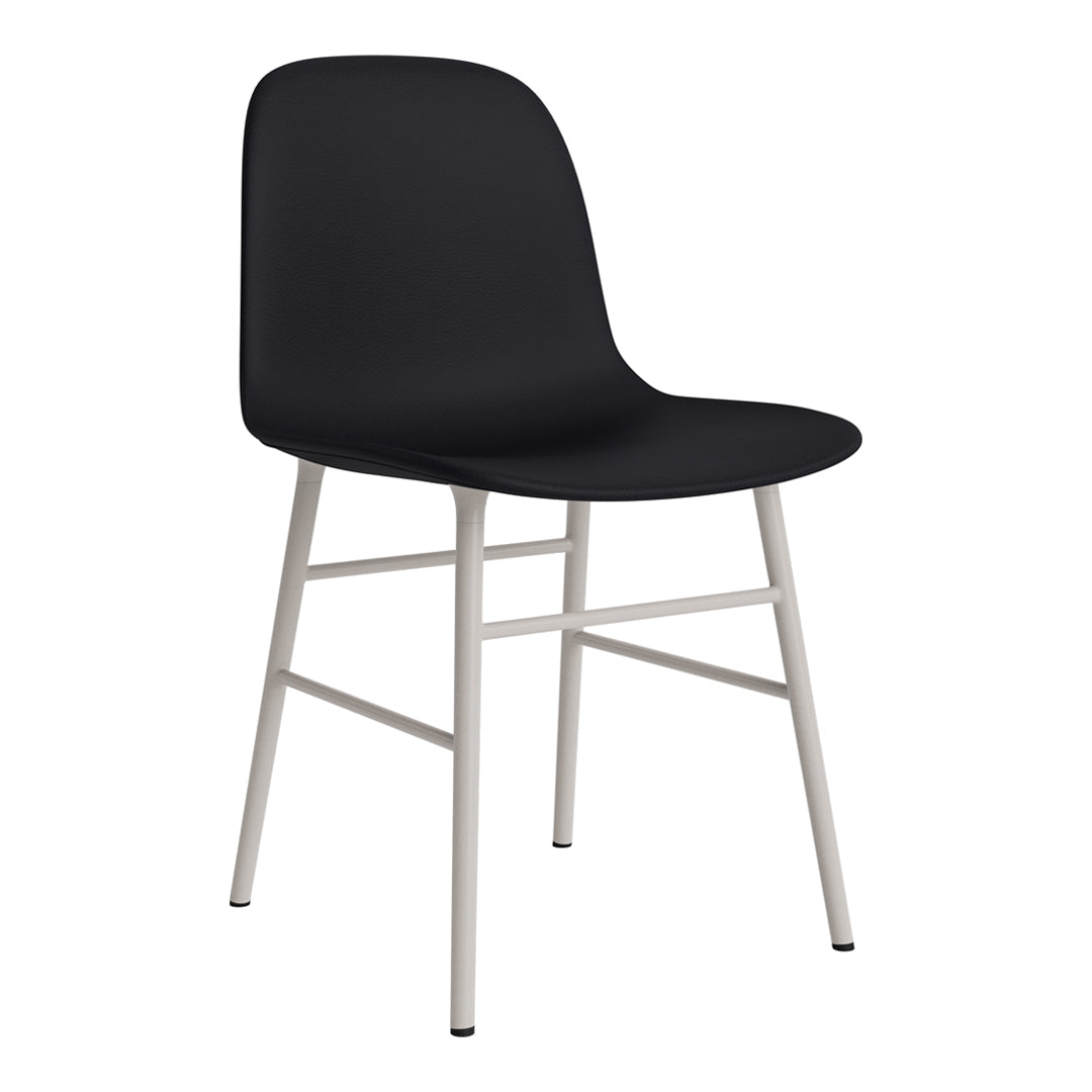 Modern black chair with smooth finish and sleek silver legs, perfect for minimalist decor.
