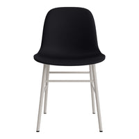 Modern black chair with smooth curves and minimalist white legs, perfect for contemporary decor.