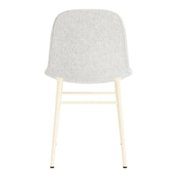 Gray upholstered chair with a smooth texture and light wood legs, showcasing a minimalist design.