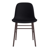 Modern black chair with smooth, curved seat and sleek brown legs, offering a minimalist style for any decor.